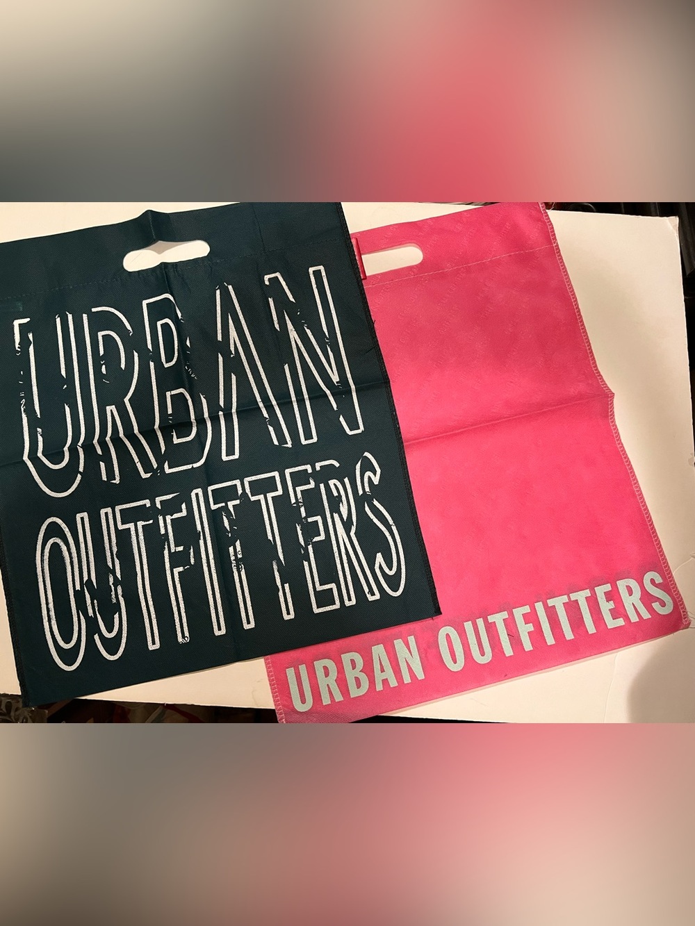 LOT OF 2 REUSABLE URBAN OUTFITTERS BAGS.